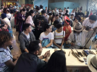 Learning how to use the erhu, a traditional Chinese instrument that is similar to a violin