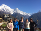 Our group is standing with the sacred mountain callled Annapurna Dakshin behind us on one of the rare clear days of our trip