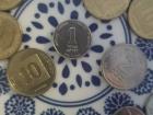 The three in the center are 10 "agorot", 1 "shekel", and 2 "shekels" that I still have from my time abroad!