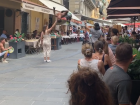 A Brazilian martial arts group performing between restaurants in the "pedestrian only" zone of old Nice