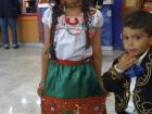 My brother and me in traditional Mexican outfits on Mexican Independence Day