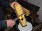 This is an example of what a wheel of raclette looks like, as it's being melted 