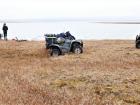 Taking in the scene of the tundra and lake