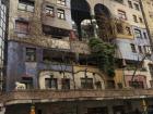 This is the Hundertwasserhaus, a colorful apartment building with fun and funky architecture