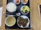 Traditional Korean marinated meat with rice and side dishes