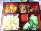 Bento box-style lunch on a boat