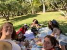 Here are my friends and I having a picnic in the park // Aquí están mis amigos y yo haciendo un picnic en el parque
