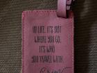 My favorite luggage tag that I received as a wedding gift sits next to our Adventure Book!
