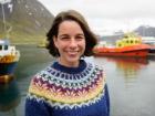 Me in my handmade Icelandic sweater by the harbor