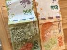 Argentine pesos: a 500 peso bill and a 1000 peso bill