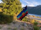 The Mapuche flag, called the wenufoye. Can you see the yellow kultrun pictured on the flag?