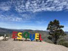 A sign displaying the name of the city where I live, Esquel, at a scenic overlook 