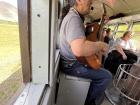 Esquel Musician Eduardo performs ülkantun for tourists on the Trochita train