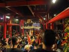 Inside a busy temple celebrating the goddess Mazu