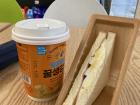 Ham, egg and cream cheese sandwich with tea bought from the convenience store 