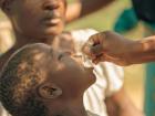 A child takes the oral vaccine to protect against cholera