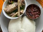 Nsima, the staple food of Malawi, with chicken and beans