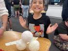 My son helping to make poi [ball on cord] in kapa haka class