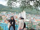 Here is a picture of my friends laughing in front of a beautiful Busan view