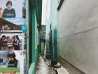 This is a cool photo of an alley in Gamcheon Culture Village with some interesting pictures on the wall