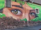 Evocative street art peers back