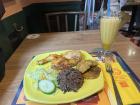 Here is a Cuban dish called fricase de pollo; it is stewed chicken with black bean rice (and also happens to be my favorite dish in Madrid)