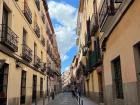 This is a photo of a street in Madrid; here you can see the typical apartment buildings (kids in Madrid live in buildings on streets like this)
