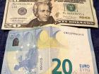 A $20 dollar bill and €20 euro