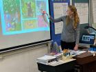 A presentation for school children associated with a mural on oak woodlands that Danza completed