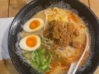 Here is another noodle dish called "ramen" with ground meat, boiled eggs, and green onions on top