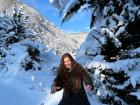 Here I am throwing a snowball in front of a snowy tree