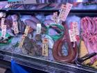 Raw fish on ice being sold at the grocery store