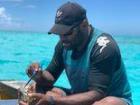 Eating fresh clam while fishing