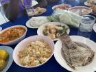 Dinner with the teachers:  geeng som (sour orange curry), fried rice, seafood salad and grilled salted fish