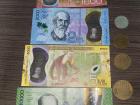 "Colones", the national currency of Costa Rica: each bill and coin is distinct in color and/or size!