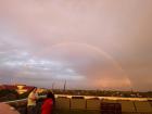 A rainbow painting the sky