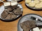 Thinly sliced beef, similar to beef jerky, with home-made sour cream, "khinkali" with potatoes and cheese and "khinkali" with meat