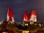 The famous flame towers of Baku, which have a light display of flames, the Azerbaijani flag and a person waving the Azerbaijani flag