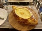 Adjarian Khachapuri (bread bowl with cheese, butter and an egg)