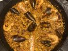 Mixed paella with shrimp, clams, mussels, prawns and chicken is so delicious