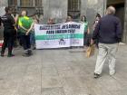 The anti-eviction organization PAH held a peaceful protest with a sign reading, " Caixabank evicts to enrich itself," to end banking impunity around the Aragon region