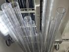 Plastic core liners stored overhead and ready to collect sediment cores