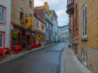 This is a street in the old town of Quebec City with a typical restaurant on the left