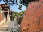 A temple's steamy waterfall in Taiwu Mountain