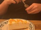 At dinner, my friend ordered a slice of cheesecake, which is Greek rather than French