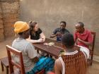 Sam, my host dad, Claude, Esperance and me playing UNO