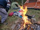 Resting by the campfire after a cold night 