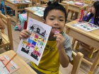 A student wearing our school's uniform during a Halloween culture lesson