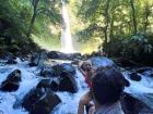 A strong waterfall close to a volcano after a big rain the night before 