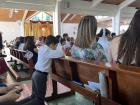 Dani, my host brother, prays after his First Communion 